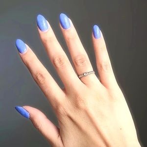 CZ solitaire twist adjustable ring.